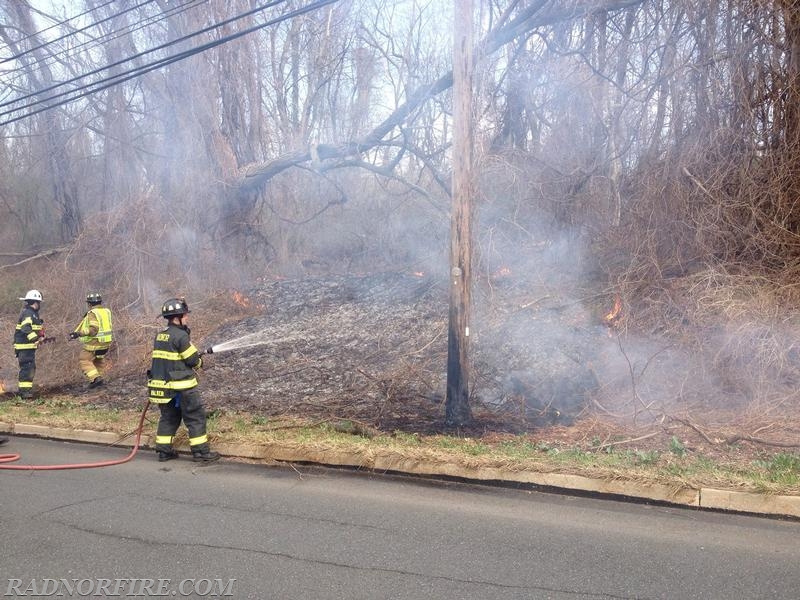 Firefighter/EMT Philip Walker working with a hoseline to extinguish the fire.